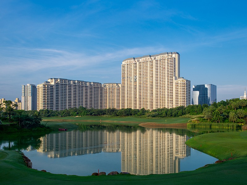 DLF The Camellias residential towers reflected in the lake