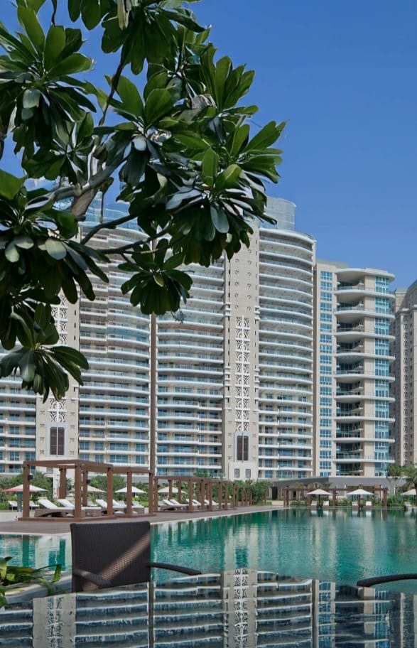 DLF The Magnolias residential towers beside the swimming pool