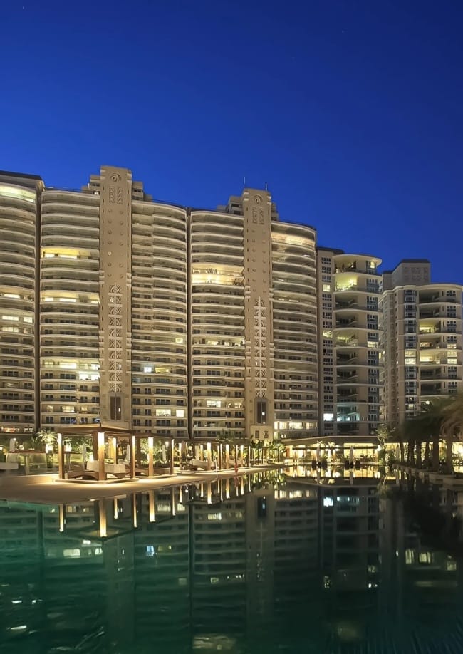 DLF The Magnolias towers and pool at night