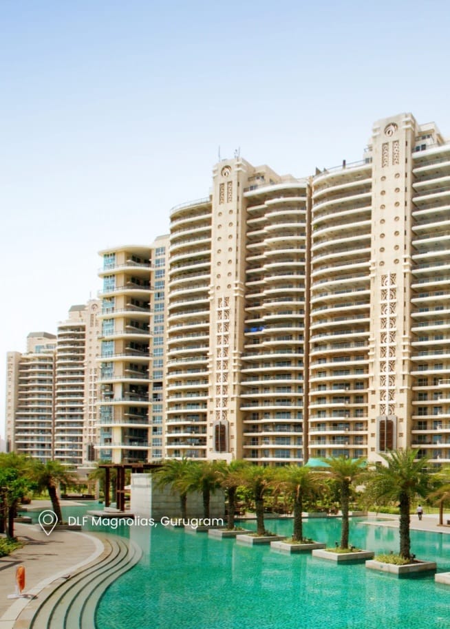 DLF The Magnolias towers rising above a landscaped swimming pool